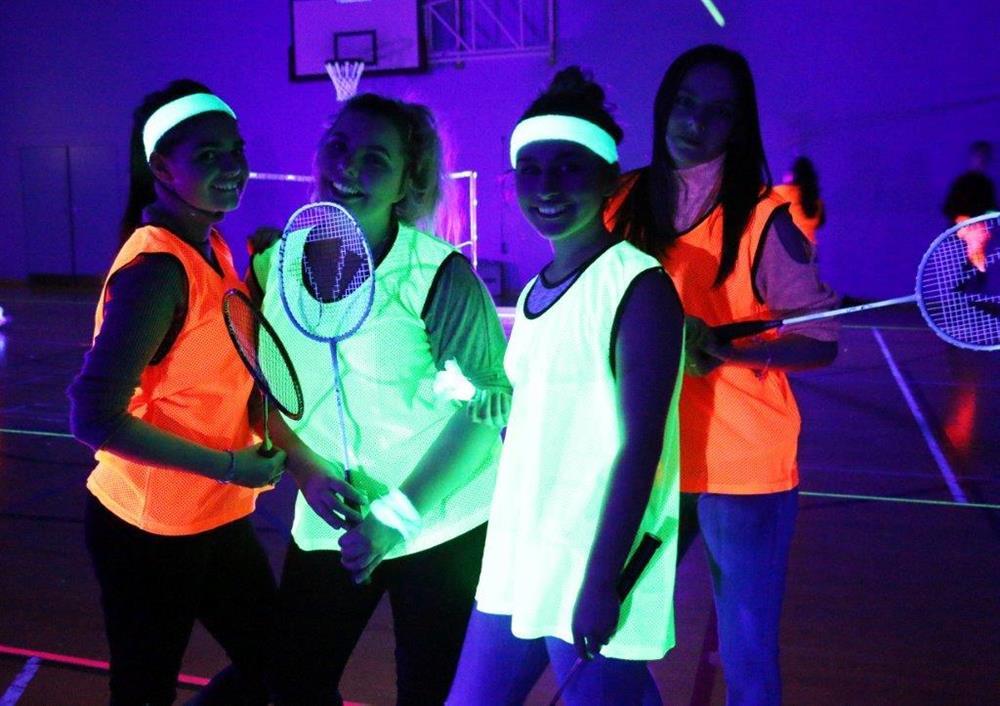 Childcare and travel and tourism students enjoyed the first round of Raveminton in the sports hall