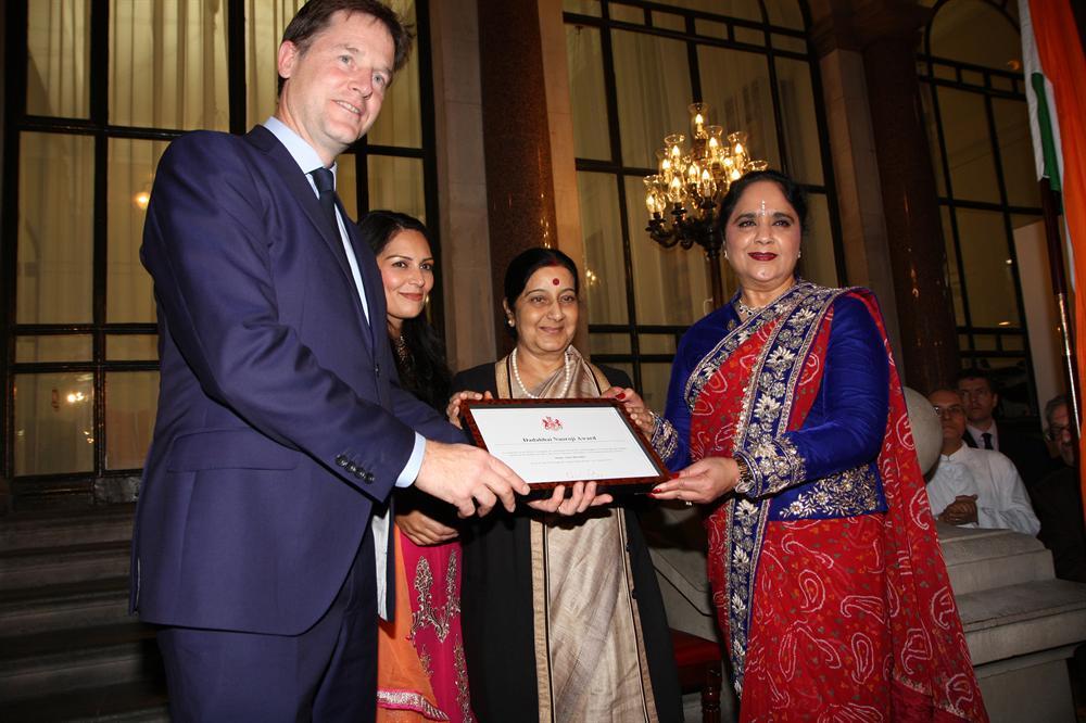 Presenting the Dadabhai Naoroji Award to Dame Asha (right) are (from left) Deputy Prime Minister Nick Clegg, UK Indian Diaspora Champion Priti Patel MP and India's External Affairs Minister Sushma Swaraj