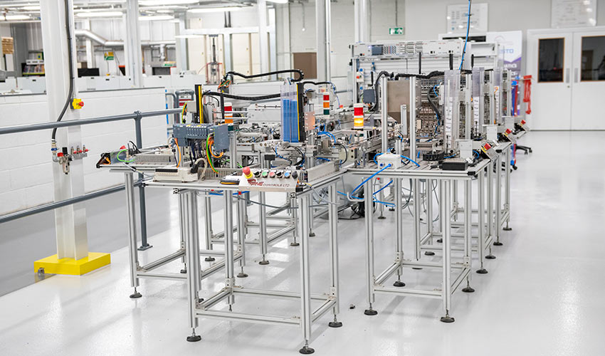 An automated assembly line with robotic equipment and conveyor systems used in modern manufacturing facilities.