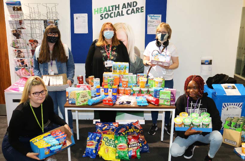 A beacon of good will for homeless. Health and social care students gave a bumper collection of produce and cash to two local charities.