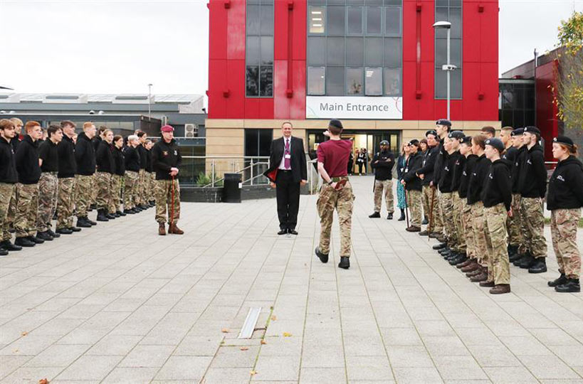 Uniformed Protective Services (UPS) students at West Nottinghamshire College proudly presented a military trials trophy to Principal Andrew Cropley after their grueling mock battlefield challenge.
