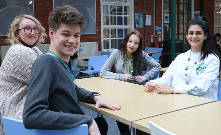 photo of four students hanging out together