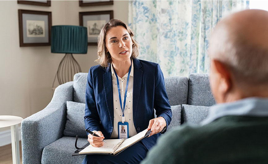 A social work professional engaging with a client, representing social work education and careers.