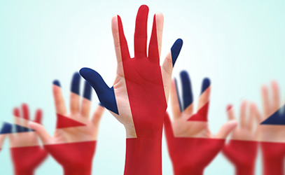 photo of hands painted in the union jack colours