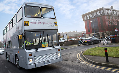 photo of bus going by the college