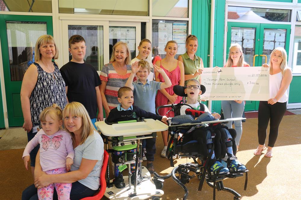 The enterprising West Nottinghamshire College students present their fundraising total to Yeoman Park School staff and pupils.