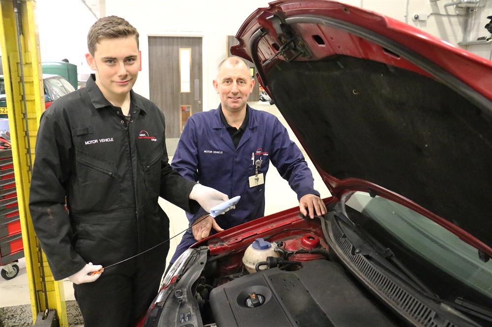Motor vehicle engineering student Braidy Ward during one of the car checks with tutor Dave Rymell