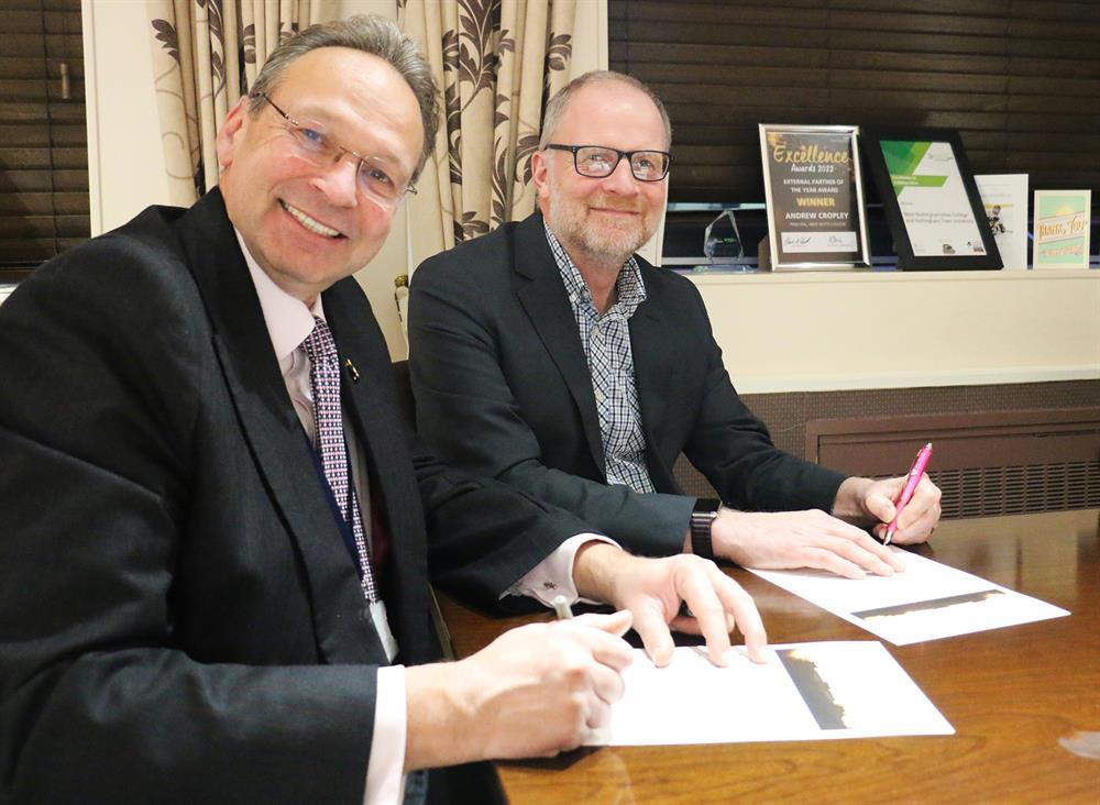 Andrew Cropley (left), principal and chief executive of the college, and Paul Robinson, chief executive of Sherwood Forest Hospitals, sign the partnership agreement between the two organisations.
