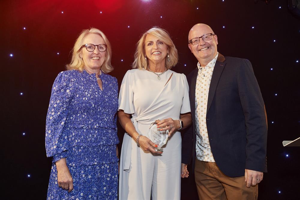 Nikki (centre) accepts her award from Sally Brook Shanahan, the Trust’s director of corporate affairs, and David Ainsworth, the Trust’s director of strategy and partnerships.
