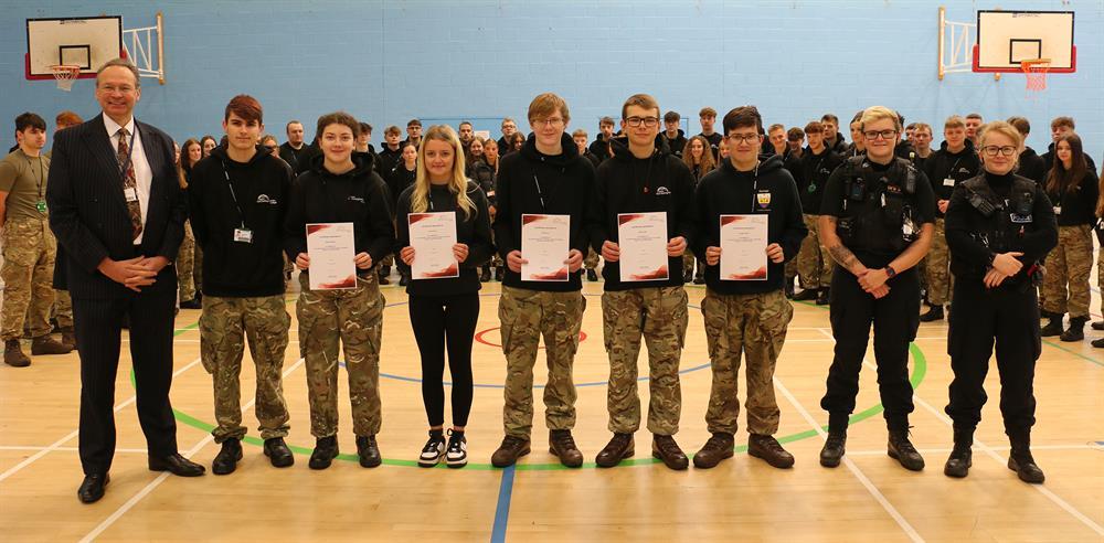 Principal Andrew Cropley (first left) with (from left) Daniel, Molly, Kelcie, Philip, Aidyn, George, PC Connellan and PC Hudson at the presentation of the certificates of achievement.
